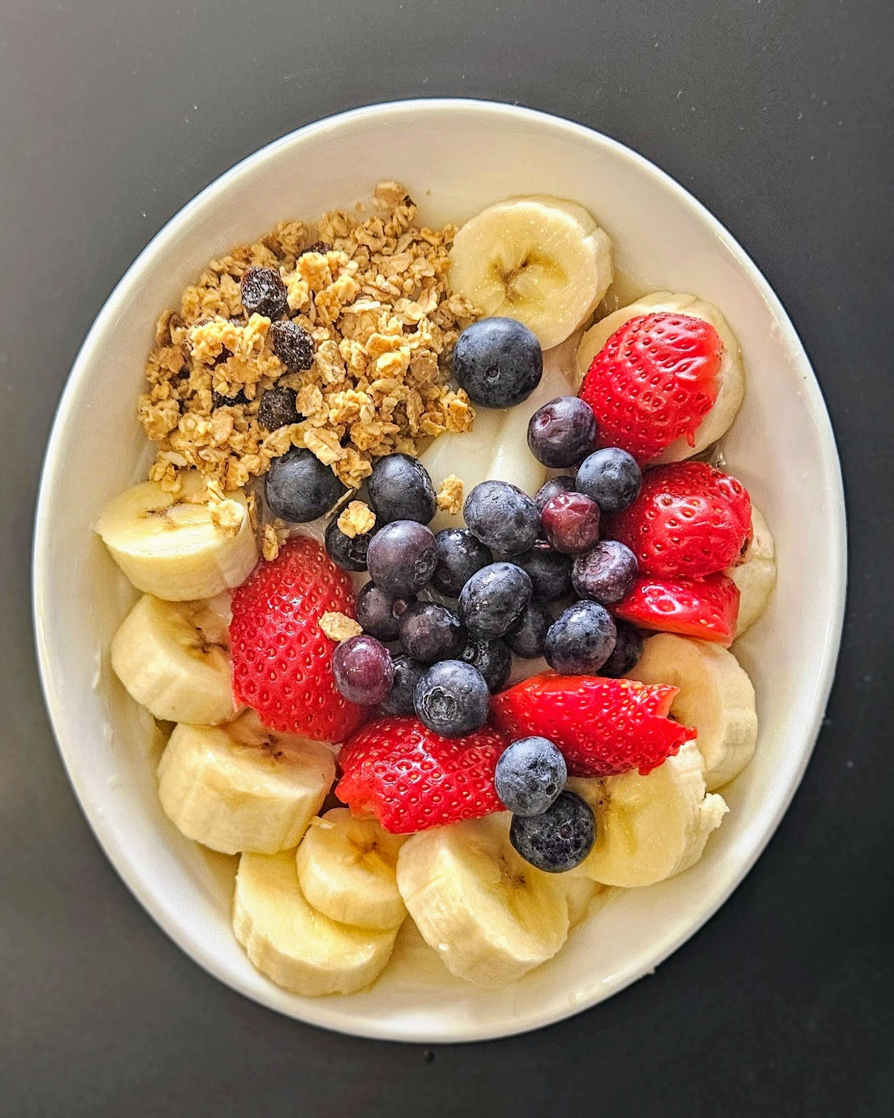 Healthy Poshy Ogi Bowl with Fruits & Granola - A wholesome African breakfast bowl made with smooth, fermented Poshy Ogi, topped with fresh fruits, ...
